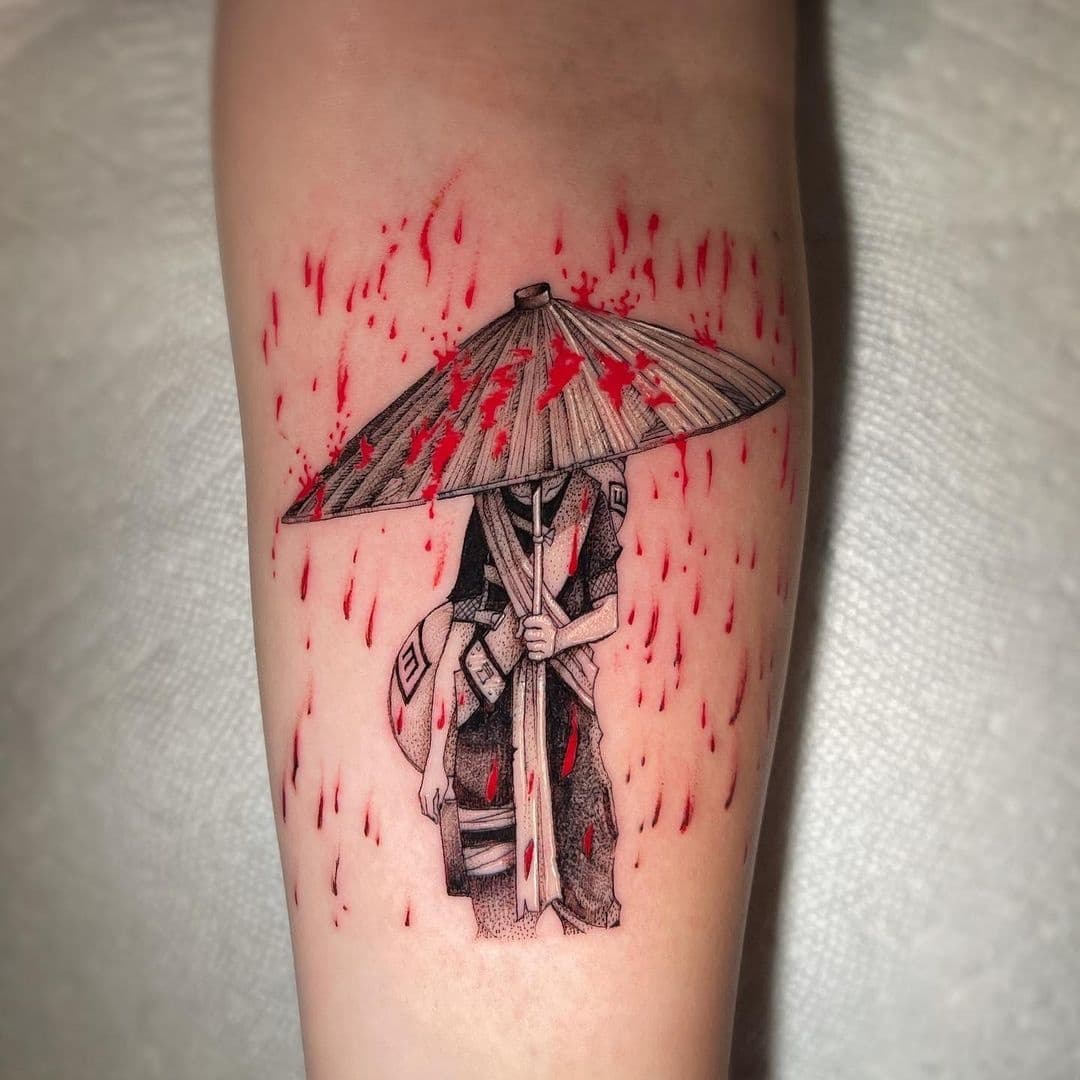 Tatuagem do Gaara com personagem sob sombrinha no braço